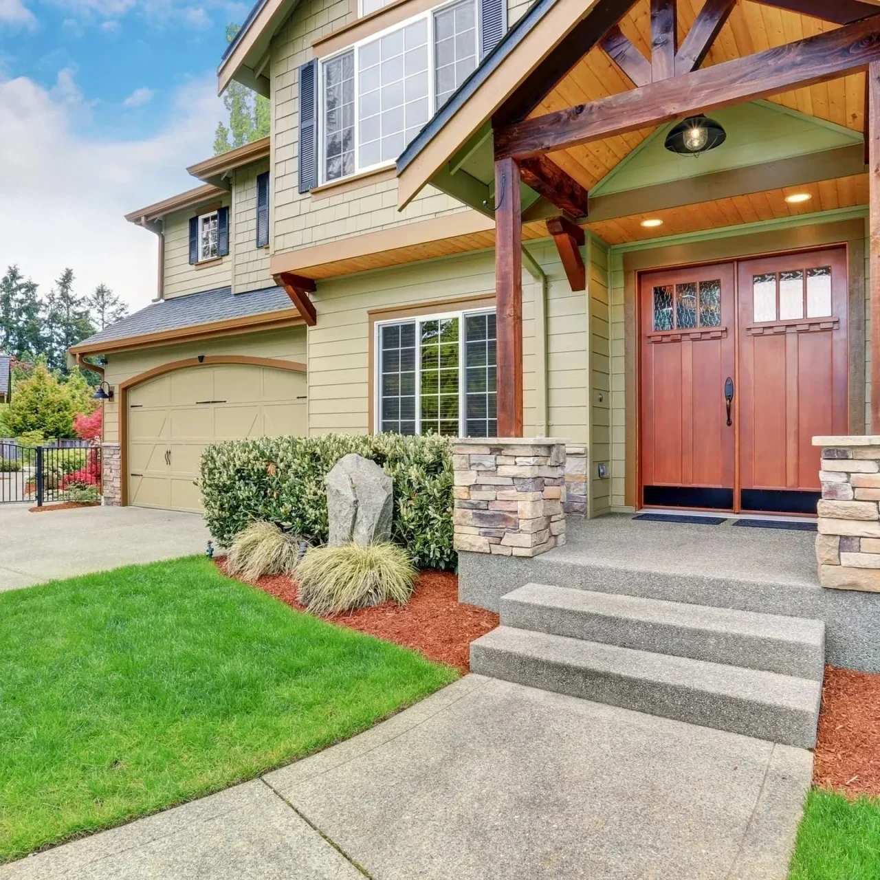 A house with a driveway and a door.